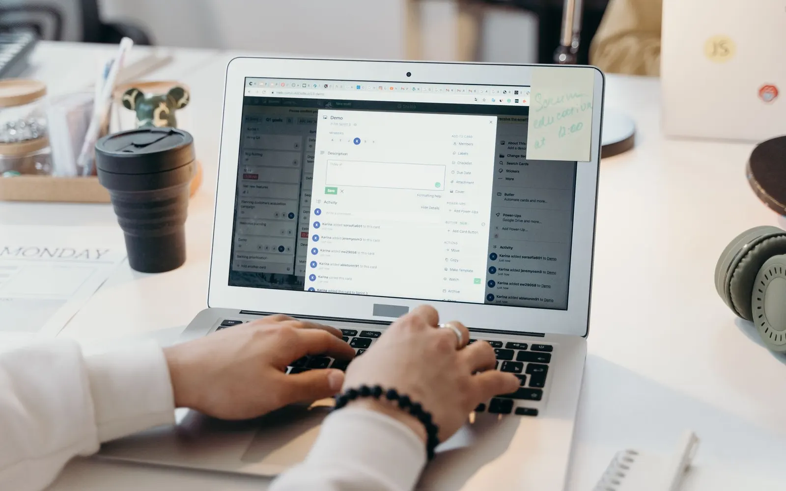 An open laptop showing an email inbox on a desk